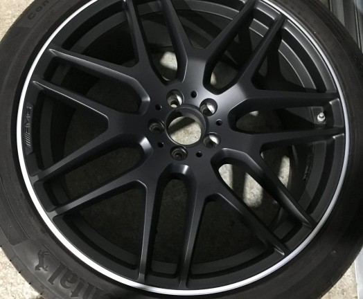 Refurbished AMG matt black alloy wheels with a machined edge