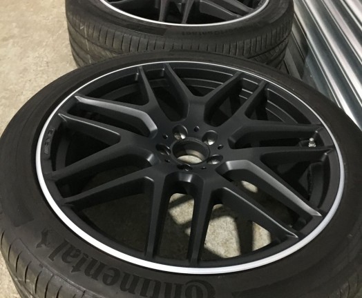 Refurbished AMG matt black alloy wheels with a machined edge